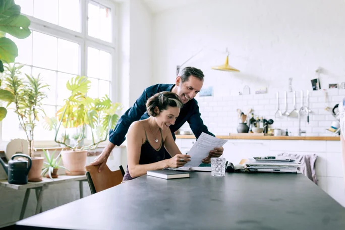 Couple reading a letter and smiling