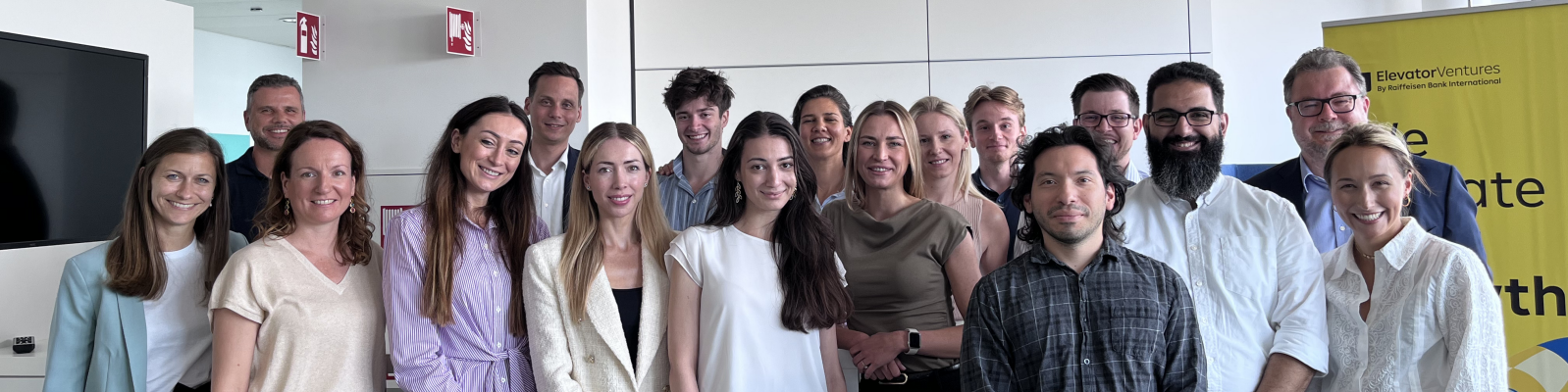 Group photo in modern office setting