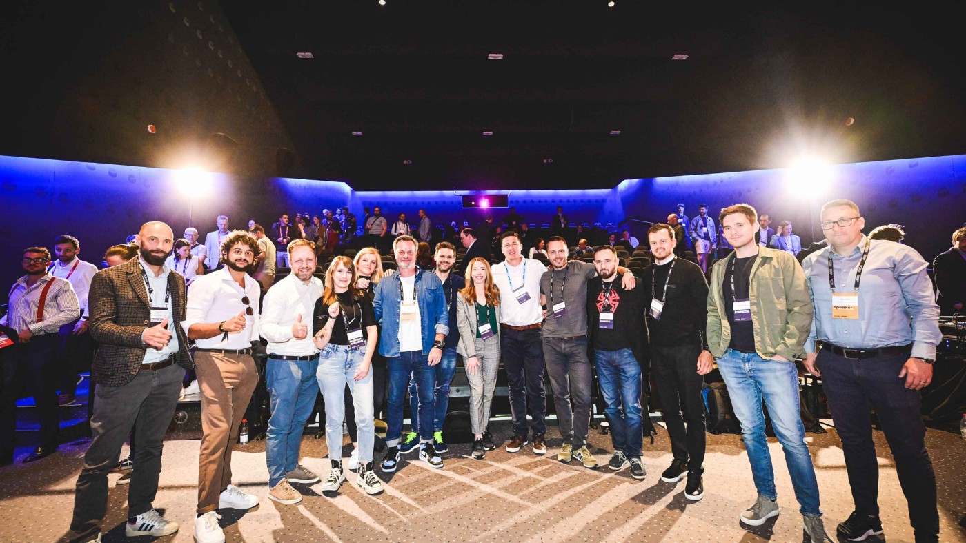 Group picture taken on a stage during an full-scale event